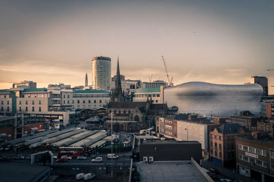 Cityscape against sky during sunset