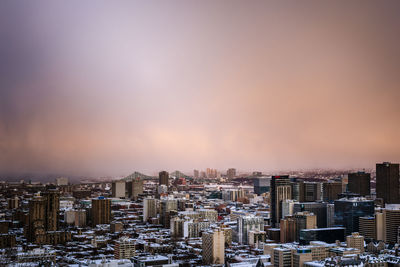 High angle view of buildings against sky during sunset
