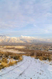 Scenic view of snowcapped mountains against sky