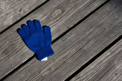 High angle view of glove wooden table