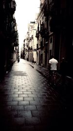 Narrow alley with buildings in background