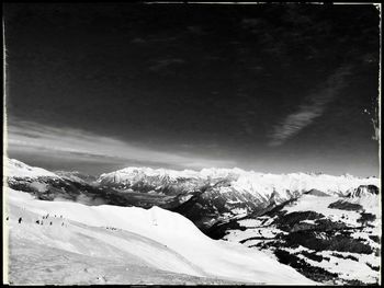 Scenic view of snow covered mountains