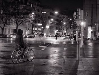 Blurred motion of people on road at night