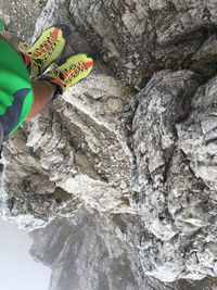 Midsection of person holding rock