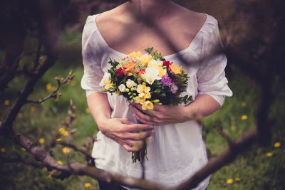 Close-up of girl holding flower