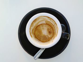 High angle view of coffee cup against white background