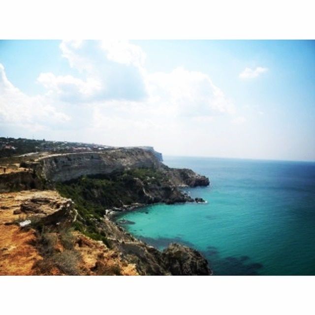 sea, water, scenics, tranquil scene, transfer print, horizon over water, beauty in nature, tranquility, sky, nature, auto post production filter, rock formation, coastline, rock - object, cliff, rock, blue, idyllic, seascape, mountain