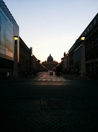 Road along buildings in city