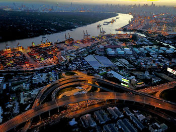 High angle view of city lit up at night