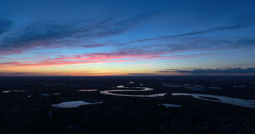 Scenic view of sunset over city