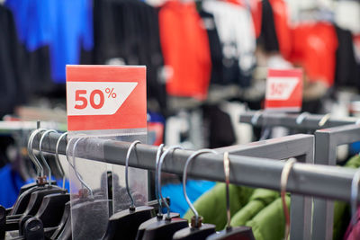 Seasonal sale 50 per cent off, holiday discounts in shopping mall