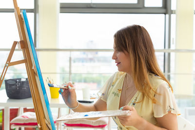 Woman sitting in room