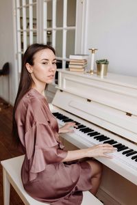 A woman playing the piano