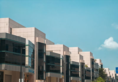 Low angle view of modern buildings against clear sky