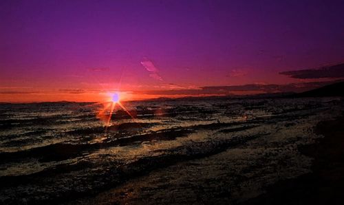 Scenic view of sunset over land