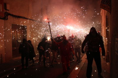 Correfoc parties, typical with firecrackers and lights in the towns