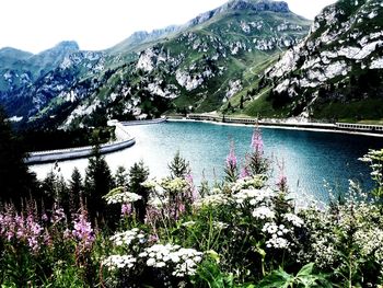 Scenic view of lake with mountains in background