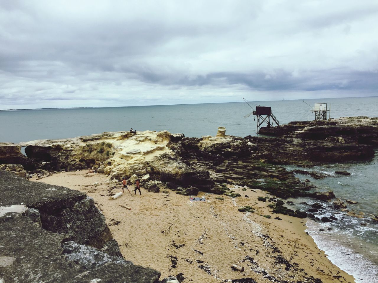 sea, sky, water, beach, cloud - sky, horizon over water, cloudy, shore, tranquil scene, tranquility, scenics, beauty in nature, nature, cloud, pier, weather, idyllic, overcast, rock - object, remote, outdoors, day, calm, coastline, non-urban scene, ocean, wooden post