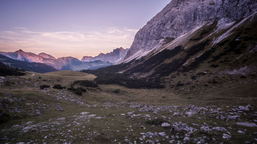 Scenic view of snowcapped mountains against sky during sunset