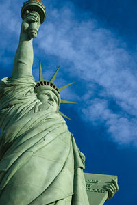 Low angle view of statue against cloudy sky