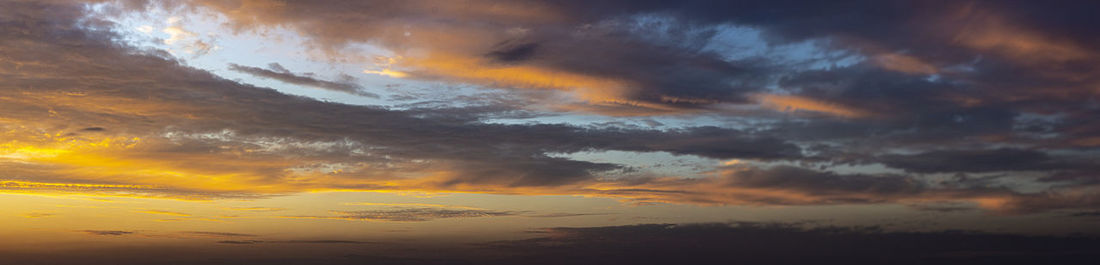 Low angle view of dramatic sky during sunset