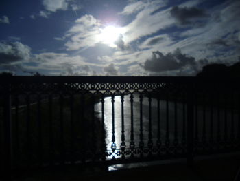 View of silhouette built structure against sky