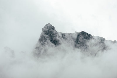 Scenic view of snow covered mountains against sky