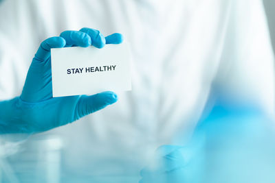 Close-up of hand holding text