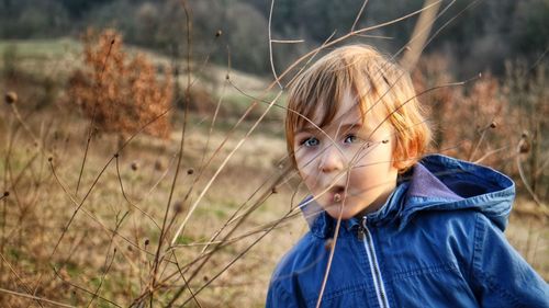 Close-up of boy on field