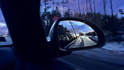 Reflection of car on side-view mirror