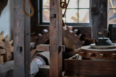 Wooden gears and teapot in factory