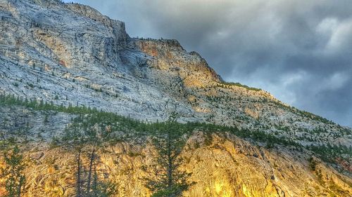 Scenic view of mountains against cloudy sky