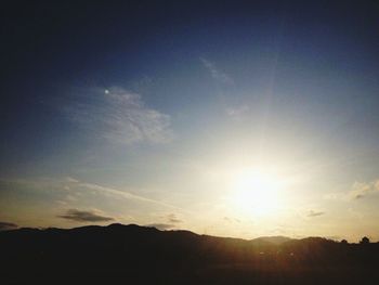 Scenic view of silhouette mountains against sky during sunset