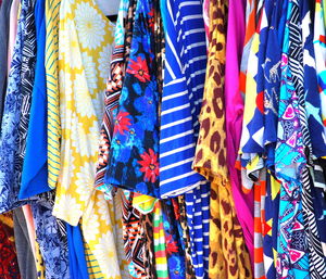 Multi colored flags hanging at market stall