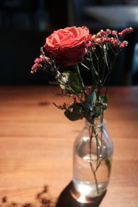 Close-up of rose flower vase on table