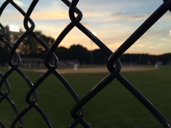 Full frame shot of chainlink fence in front of baseball field