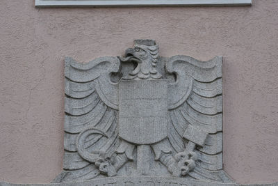 Close-up of sculpture on stone wall