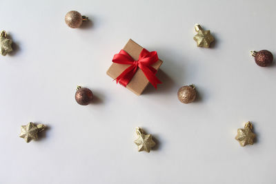 Directly above shot of christmas decorations on white background