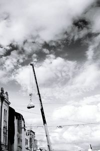 Low angle view of building against cloudy sky