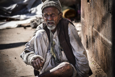 Portrait of man sitting outdoors