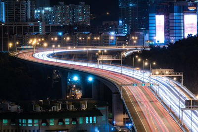 High angle view of light trail on highway at night
