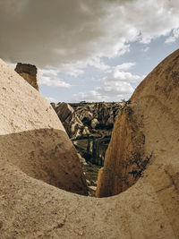 Rock formations on landscape against sky