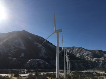 Low angle view of wind turbine against sky