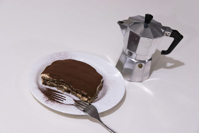 High angle view of coffee cup against white background