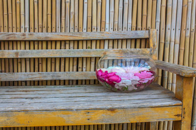 Close-up of pink flower on wood