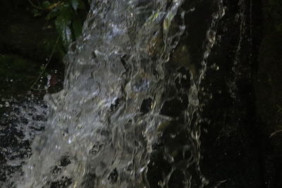 Close-up of water splashing on rocks