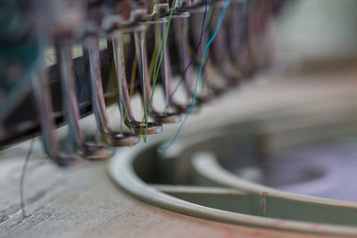 Close-up of wire hanging on wood