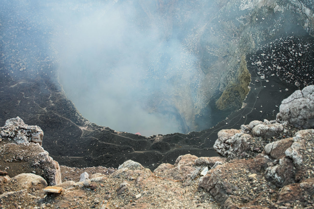 environment, landscape, geology, nature, mountain, beauty in nature, smoke, volcano, rock, land, steam, no people, scenics - nature, heat, water, non-urban scene, physical geography, outdoors, day, cloud, travel, travel destinations, sky, volcanic crater, volcanic landscape, power in nature, fog, erupting