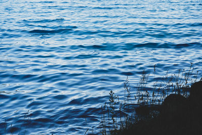 High angle view of sea against blue sky