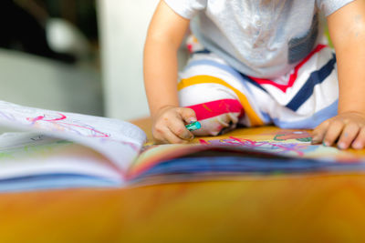 Close-up of hands on book